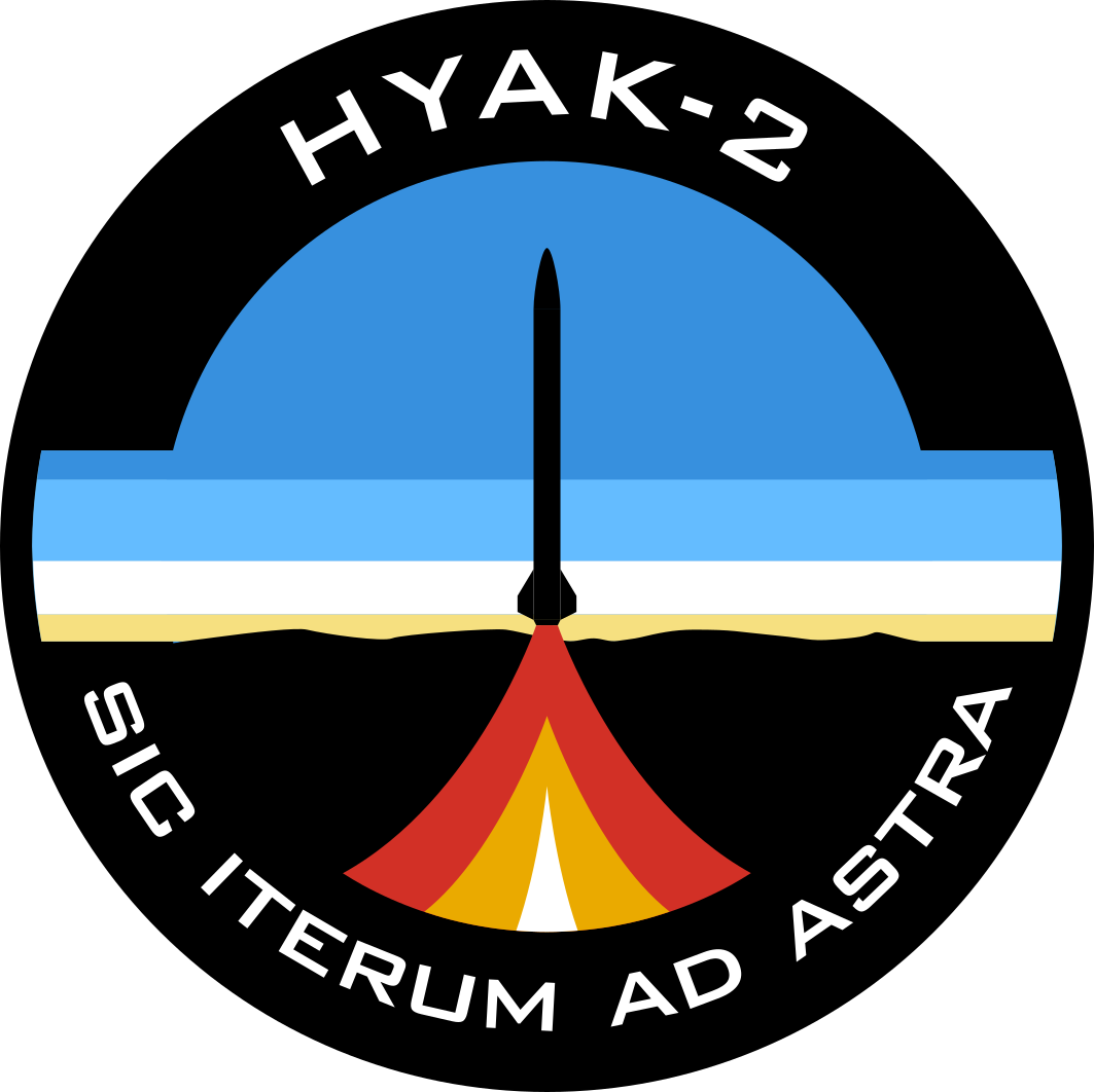 The mission patch for UVic Rocketry's Hyak-2 rocket. The patch depicts a rocket launch in the New Mexican desert, silhouetted against the sunrise.  The words 'HYAK-2' and 'SIC ITERUM AD ASTRA' are displayed.